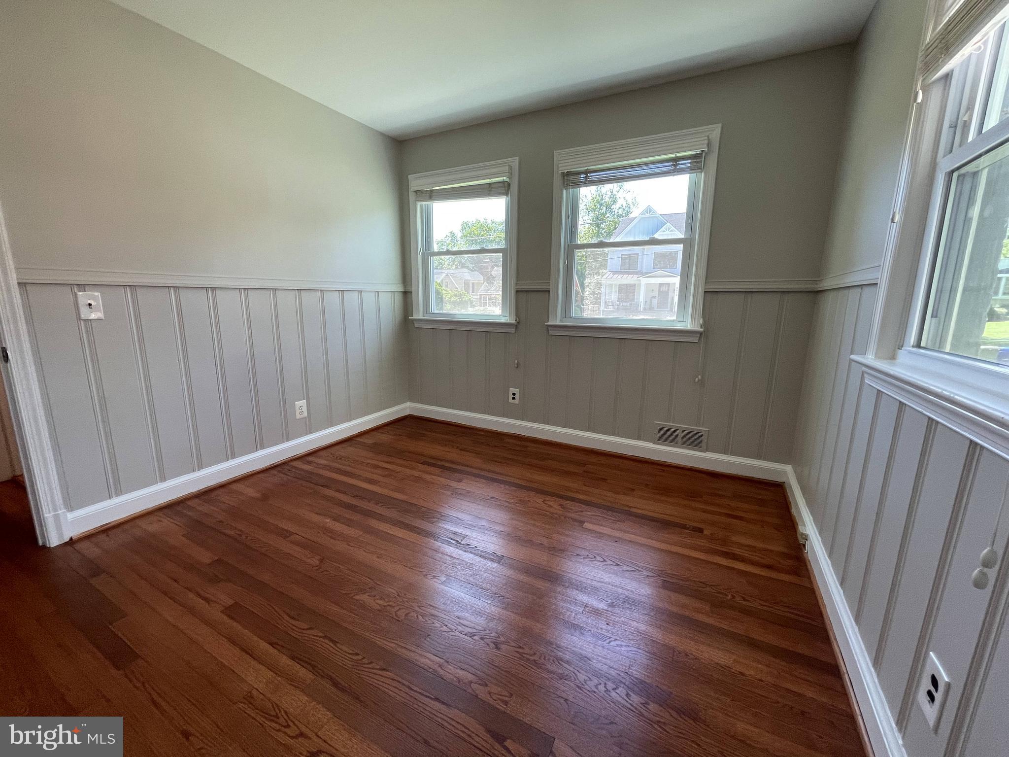5817 Kingswood Road Bethesda, MD 20814 - Photo 16 of 40 a view of an empty room with wooden floor and a window