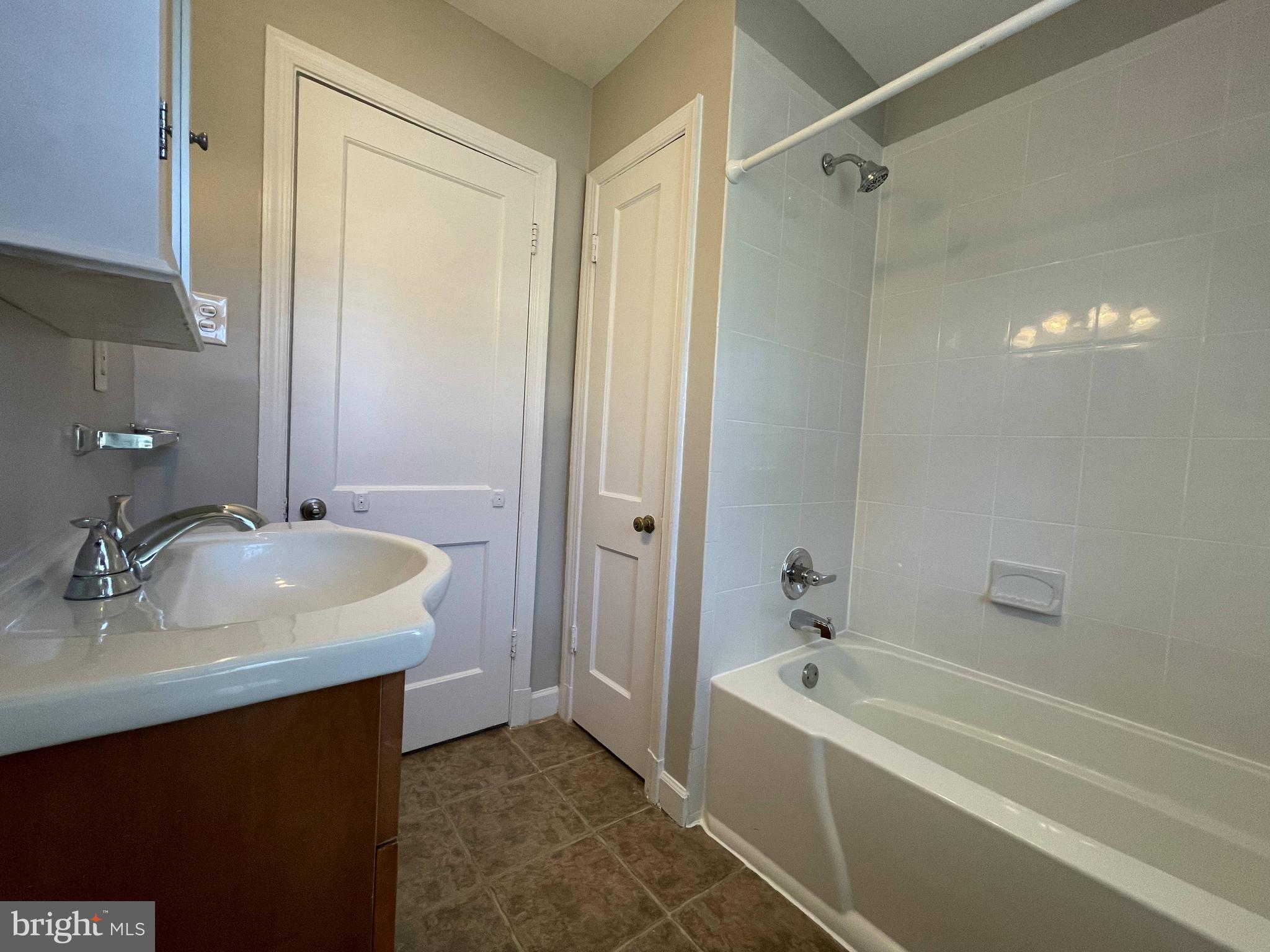 5817 Kingswood Road Bethesda, MD 20814 - Photo 21 of 40 a bathroom with a sink and a tub