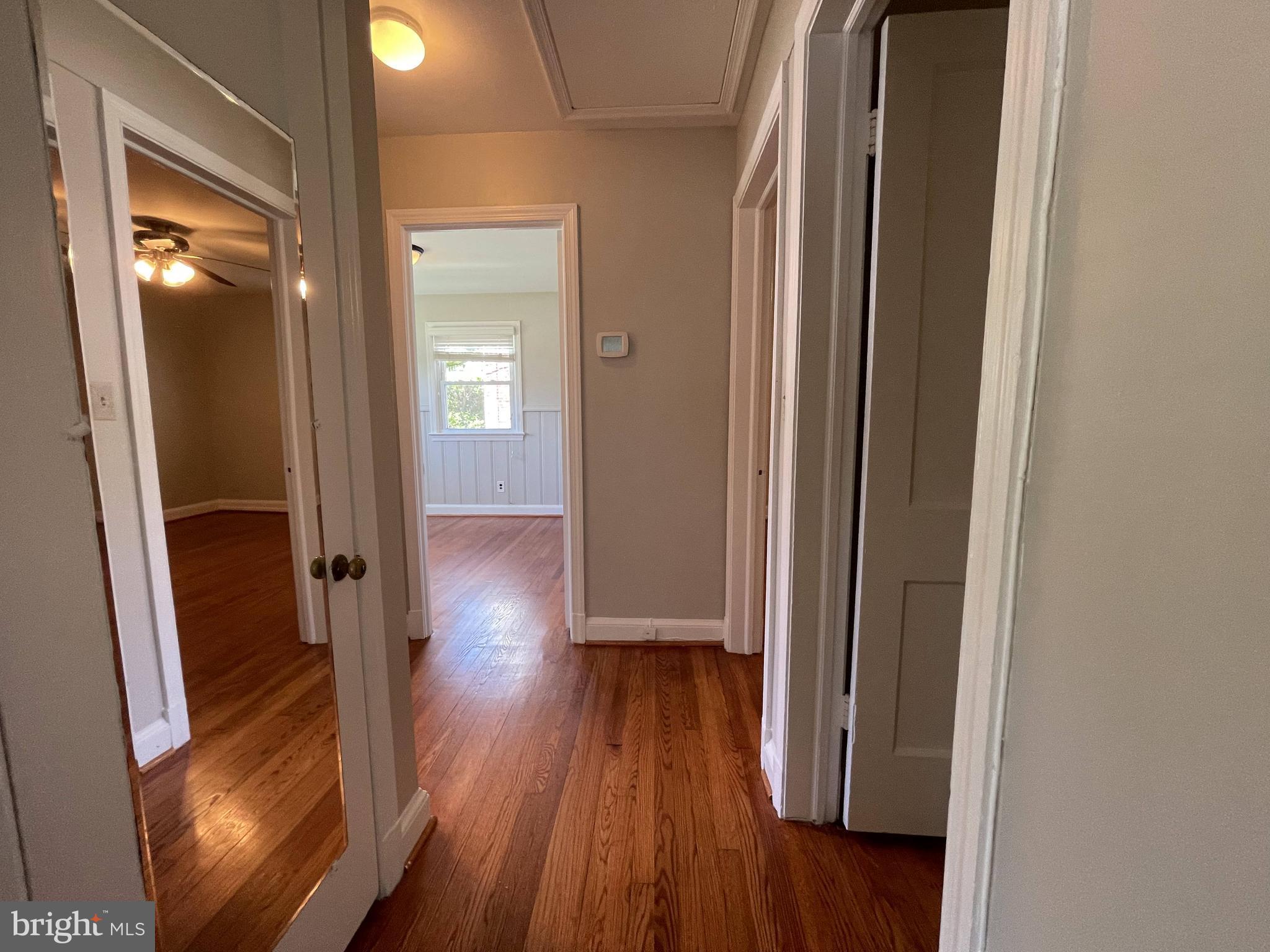 5817 Kingswood Road Bethesda, MD 20814 - Photo 26 of 40 a view of a hallway with wooden floor