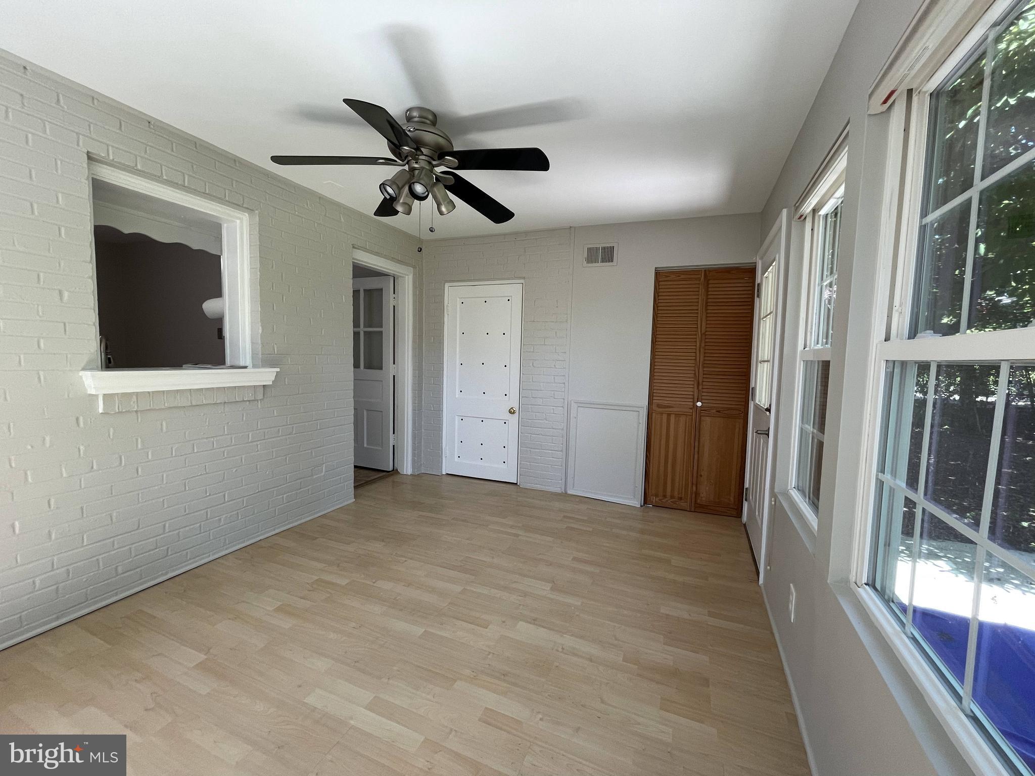 5817 Kingswood Road Bethesda, MD 20814 - Photo 28 of 40 a view of a livingroom with a ceiling fan and window