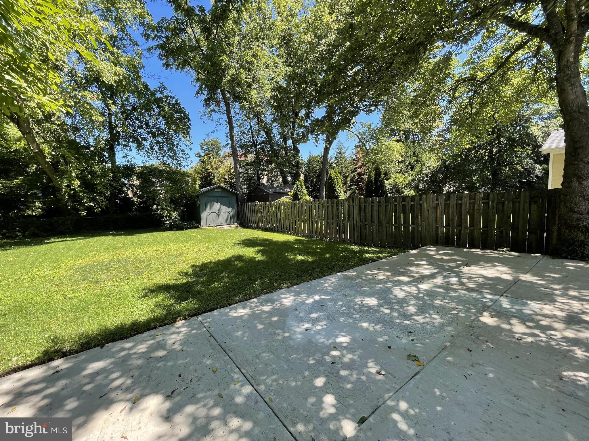 5817 Kingswood Road Bethesda, MD 20814 - Photo 35 of 40 a view of a backyard with large trees