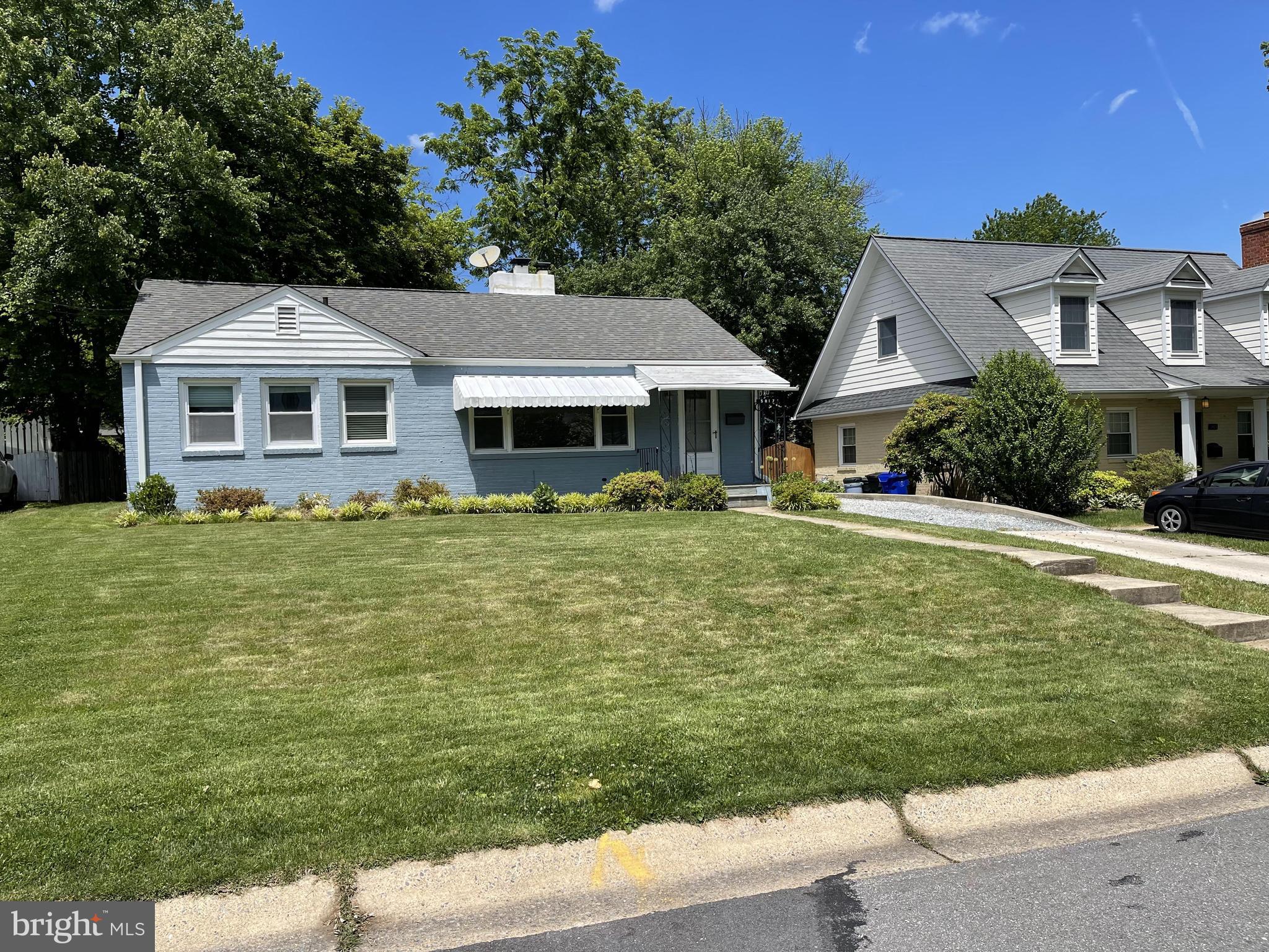 5817 Kingswood Road Bethesda, MD 20814 - Photo 5 of 40 a front view of a house with garden