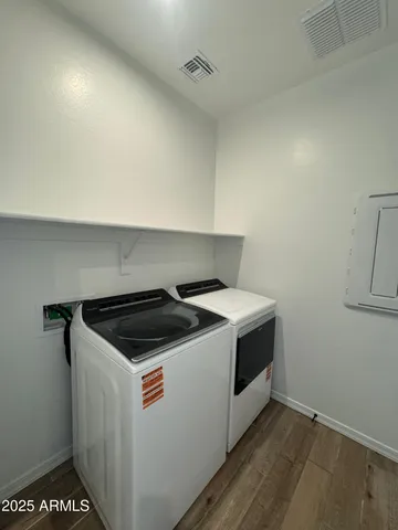 a utility room with washer and dryer