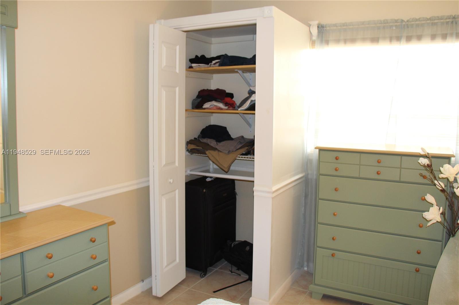 5620 Southwest 3rd Place, Unit 114 Margate, FL 33068 - Photo 13 of 29 a kitchen with a refrigerator and a cabinets