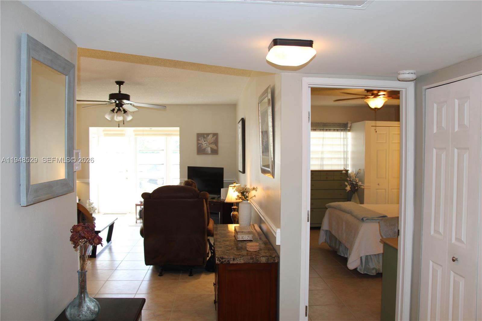 5620 Southwest 3rd Place, Unit 114 Margate, FL 33068 - Photo 18 of 29 a living room with furniture and a window
