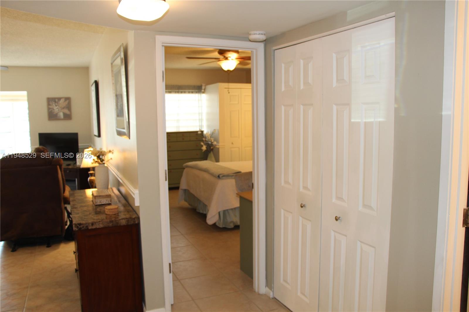 5620 Southwest 3rd Place, Unit 114 Margate, FL 33068 - Photo 19 of 29 a bed room with a bed and a window