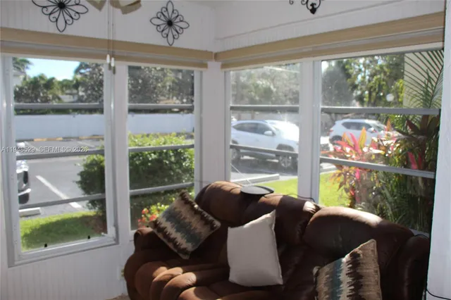 a room with furniture and a large window
