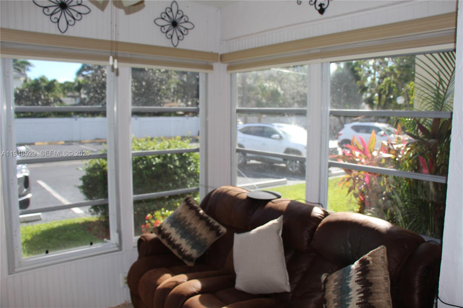 5620 Southwest 3rd Place, Unit 114 Margate, FL 33068 - Photo 21 of 29 a room with furniture and a large window