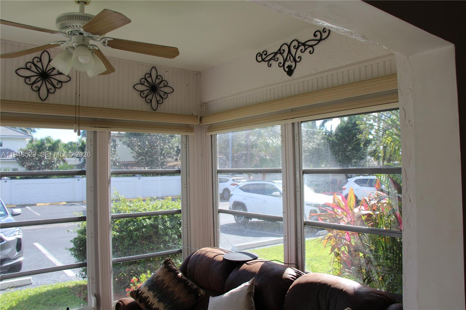 5620 Southwest 3rd Place, Unit 114 Margate, FL 33068 - Photo 22 of 29 a living room with large windows