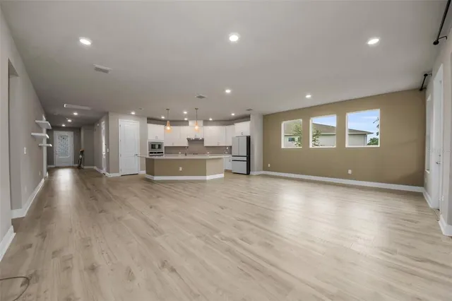a view of a kitchen with a sink and a stove