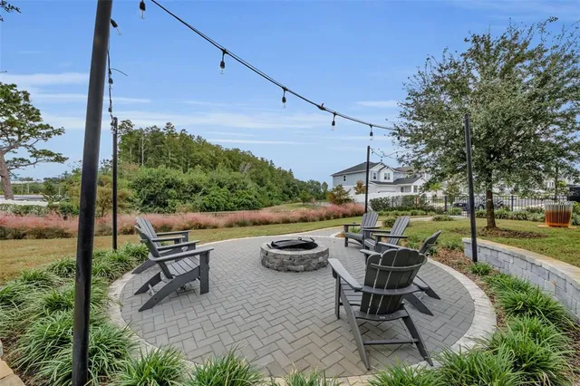 a view of a backyard with sitting area