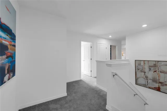 a spacious bathroom with a double vanity sink a mirror and a shower