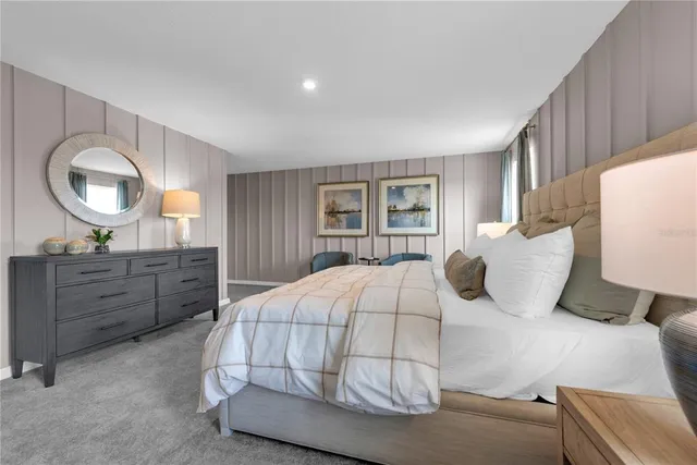 a bedroom with a bed and a lamp