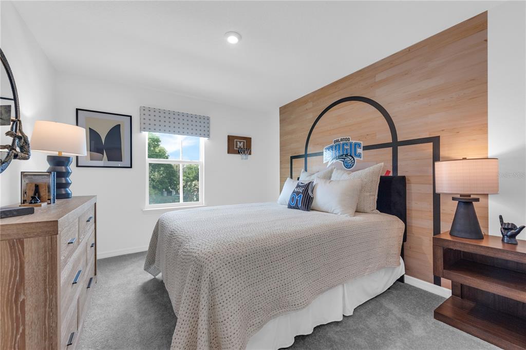 643 Rockaway Lane Cocoa, FL 32927 - Photo 23 of 34 a bedroom with a bed and a lamp