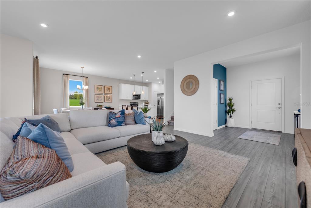 643 Rockaway Lane Cocoa, FL 32927 - Photo 3 of 34 a living room with furniture and wooden floor