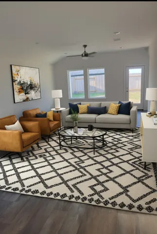 a living room with furniture and a window