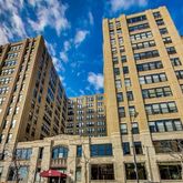a lobby with furniture and floor to ceiling window