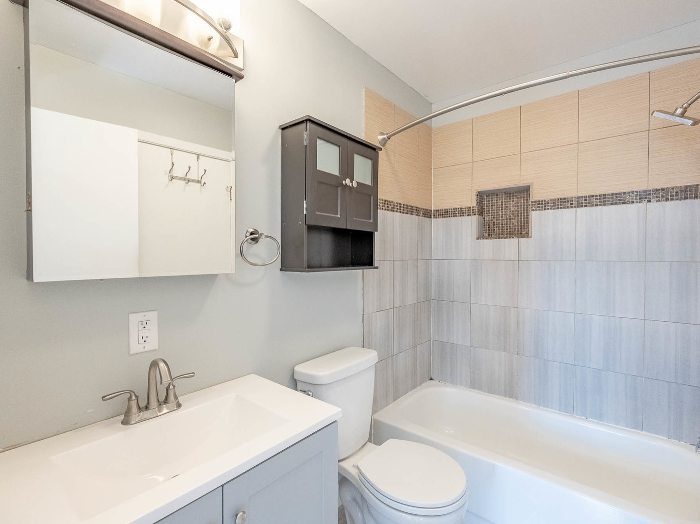 2214 Colorado Avenue, Unit 2214 Elgin, IL 60123 - Photo 12 of 14 a bathroom with a sink toilet and shower