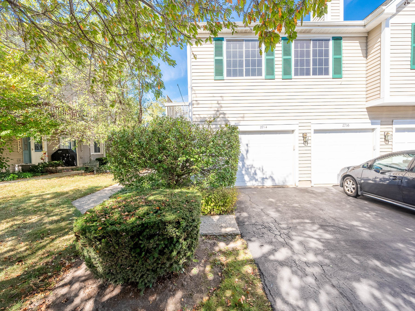 2214 Colorado Avenue, Unit 2214 Elgin, IL 60123 - Photo 2 of 14 a view of a yard with car parked