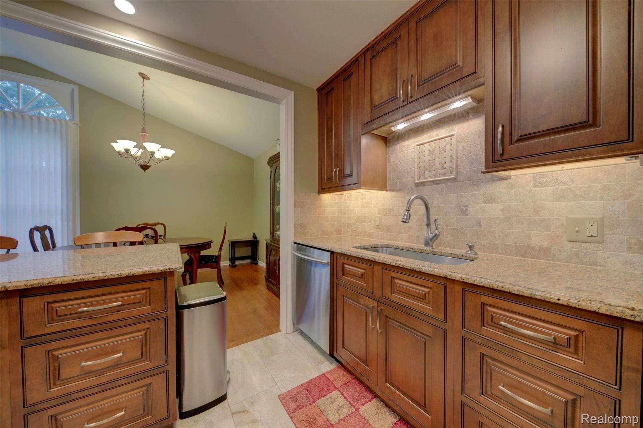 1161 Pine Ridge Court, Unit 143 Rochester, MI 48306 - Photo 40 of 45 CUSTOM KITCHEN CABINETS AND BACKSPLASH