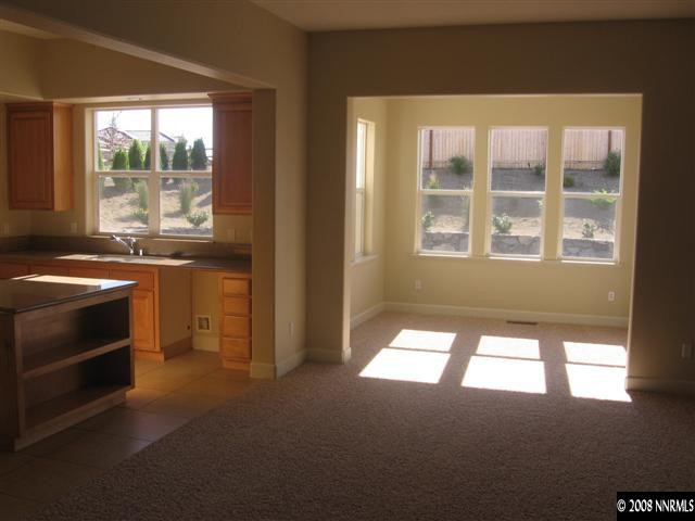 8564 Timaru Trail Reno, NV 89523 - Photo 5 of 8 a kitchen that has a stove top oven