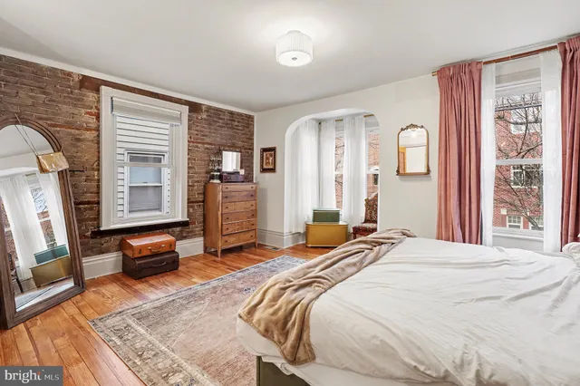 a bedroom with a bed and furniture