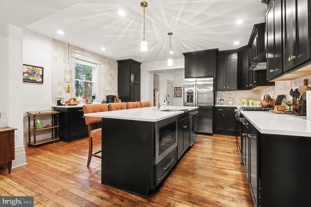 a kitchen with stainless steel appliances lots of counter top space