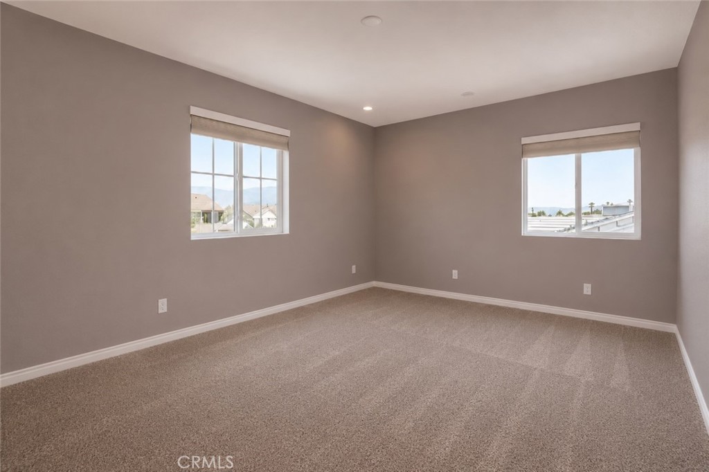 11056 Guffey Ranch Way Corona, CA 92883 - Photo 38 of 61 an empty room with windows