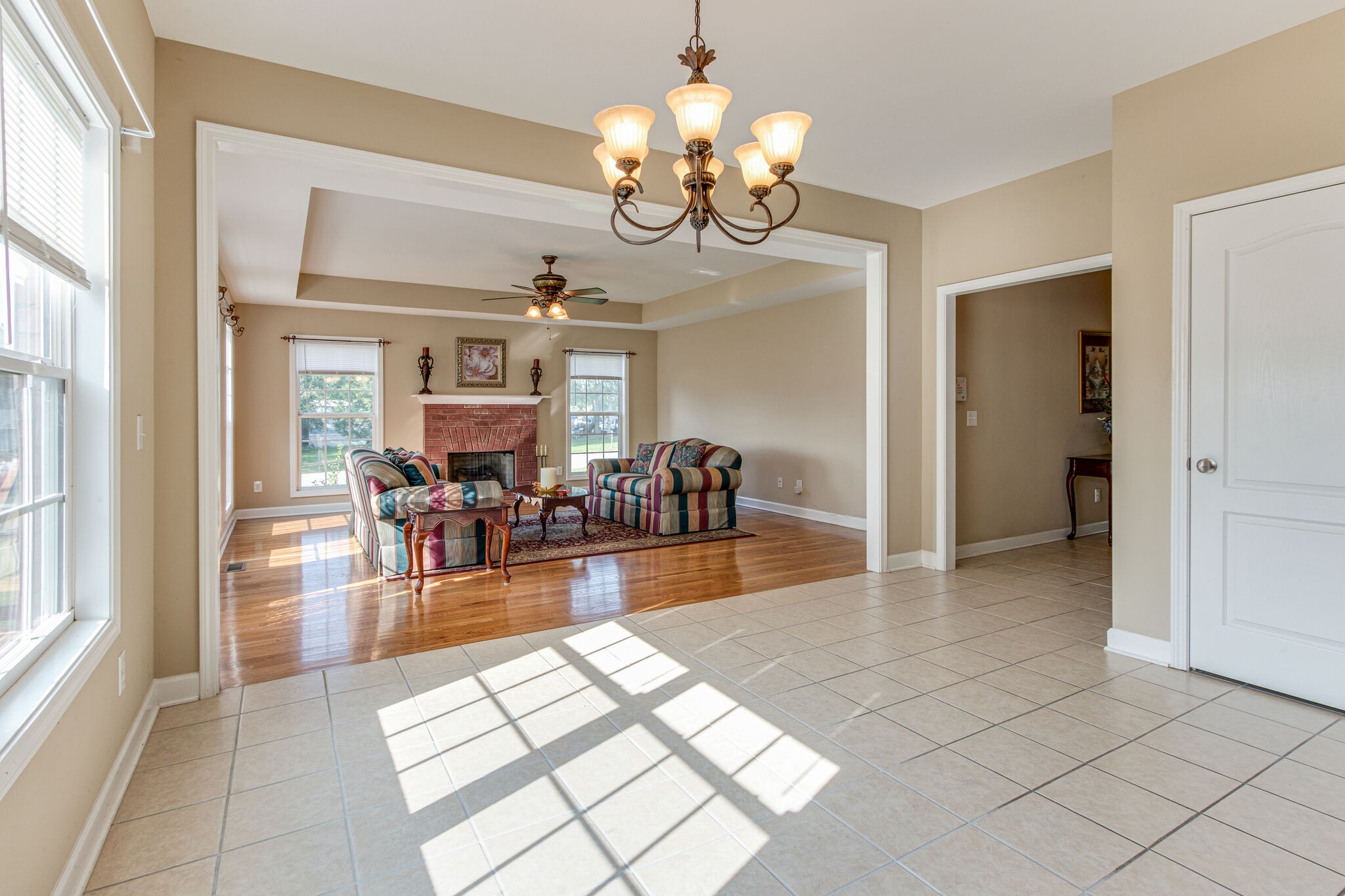 4877 Arnold Drive Murfreesboro, TN 37129 - Photo 17 of 32 a view of a dining room with furniture a chandelier and wooden floor
