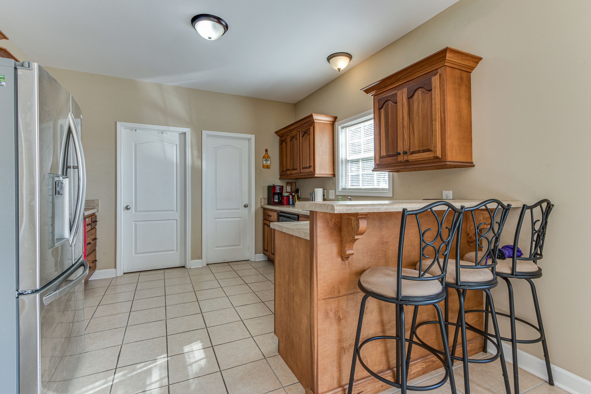 4877 Arnold Drive Murfreesboro, TN 37129 - Photo 19 of 32 a kitchen with stainless steel appliances granite countertop a refrigerator and a stove top oven