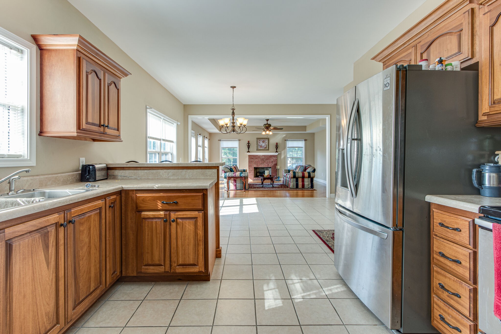 4877 Arnold Drive Murfreesboro, TN 37129 - Photo 20 of 32 a kitchen with stainless steel appliances granite countertop a refrigerator and a sink