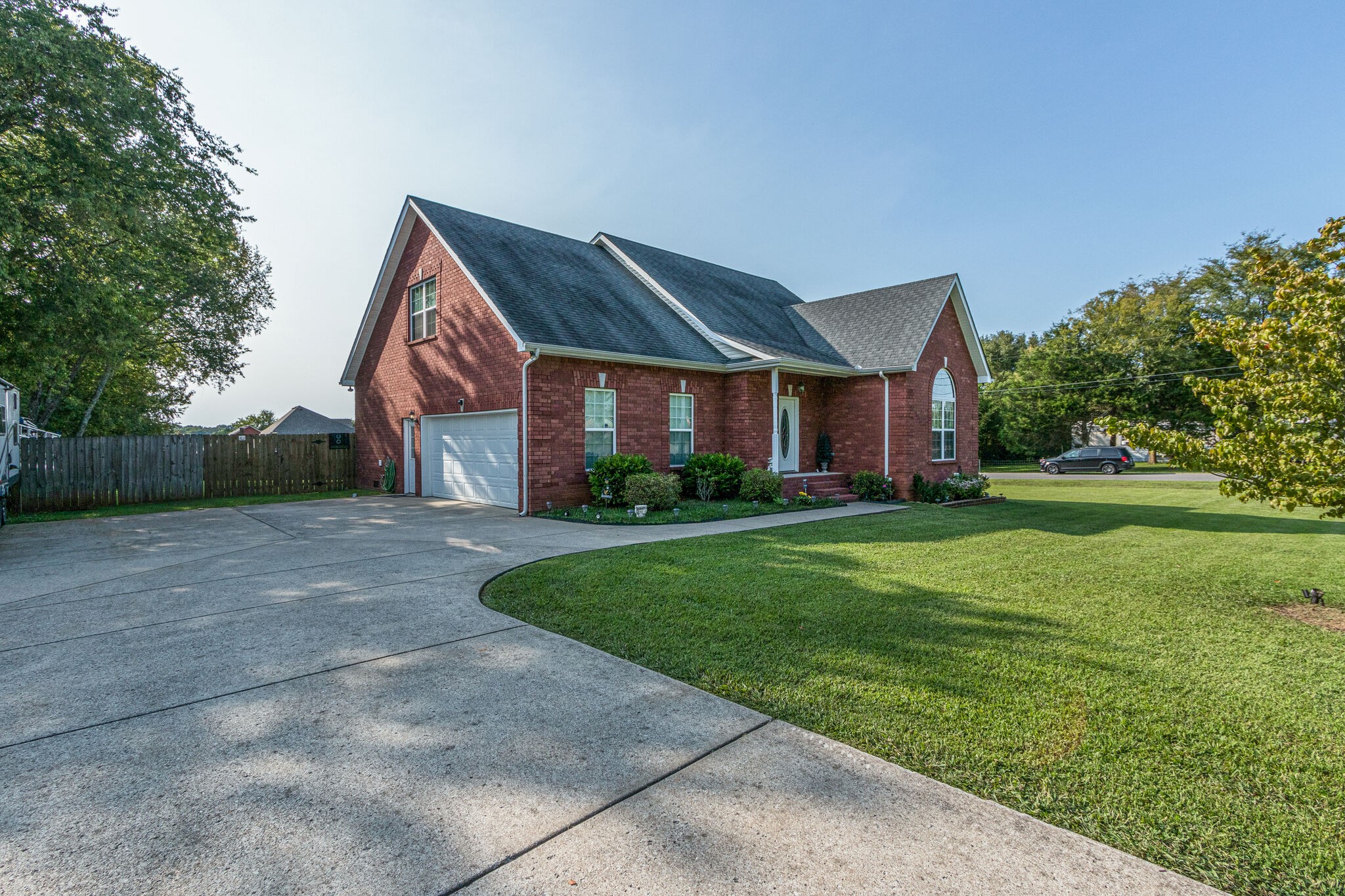 4877 Arnold Drive Murfreesboro, TN 37129 - Photo 2 of 32 a front view of a house with a yard