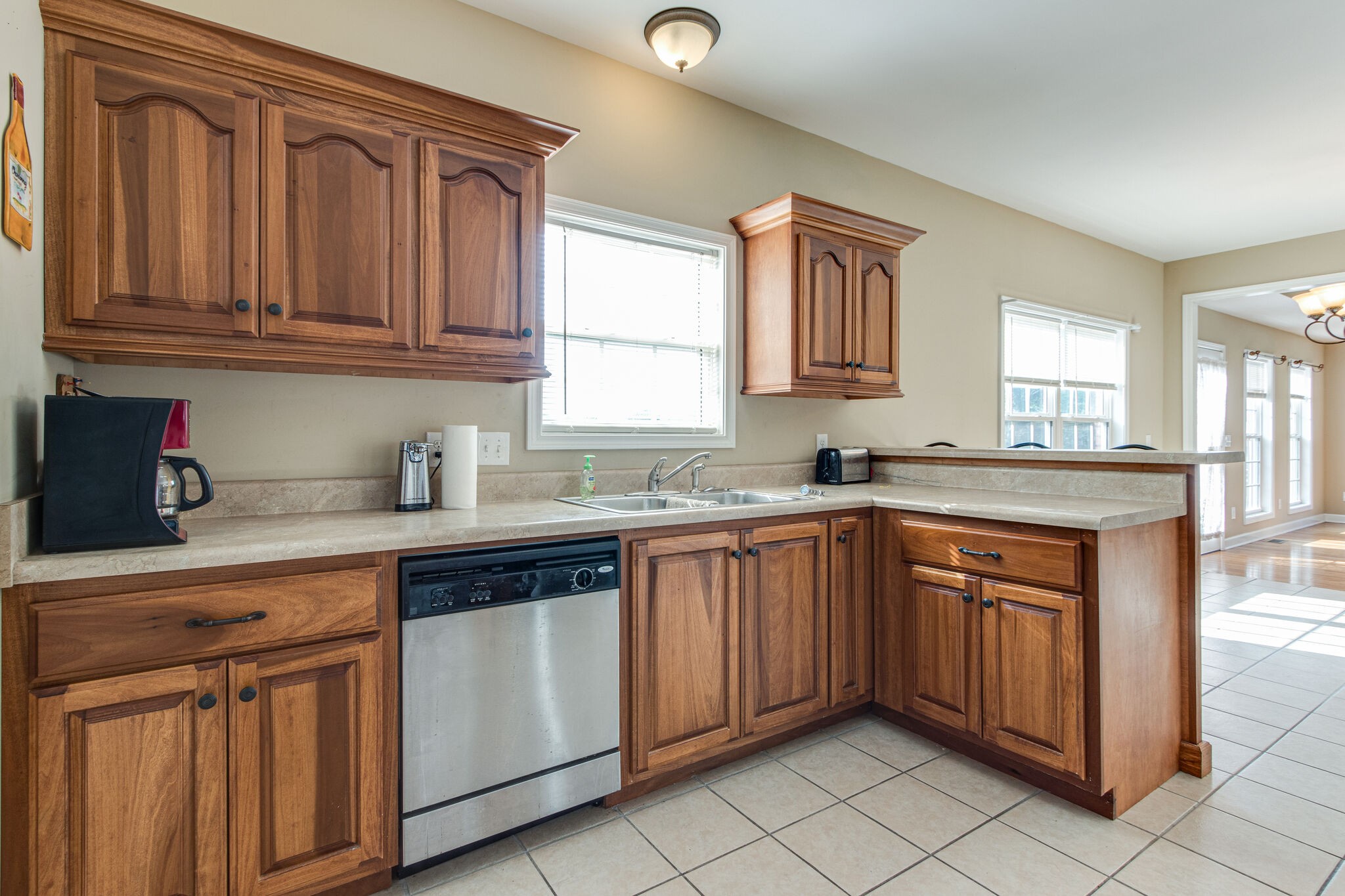 4877 Arnold Drive Murfreesboro, TN 37129 - Photo 21 of 32 a kitchen with stainless steel appliances granite countertop a sink dishwasher stove and cabinets