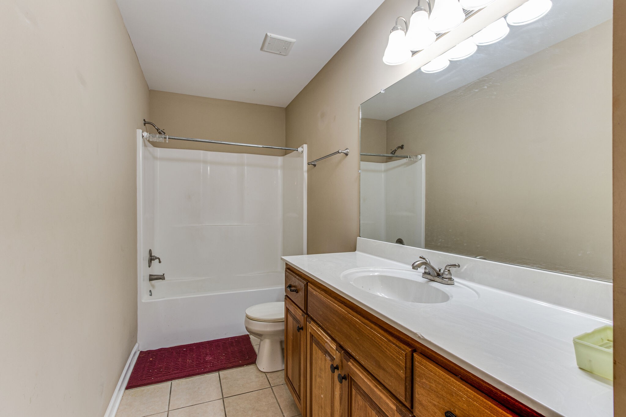 4877 Arnold Drive Murfreesboro, TN 37129 - Photo 28 of 32 a bathroom with a sink a toilet and shower