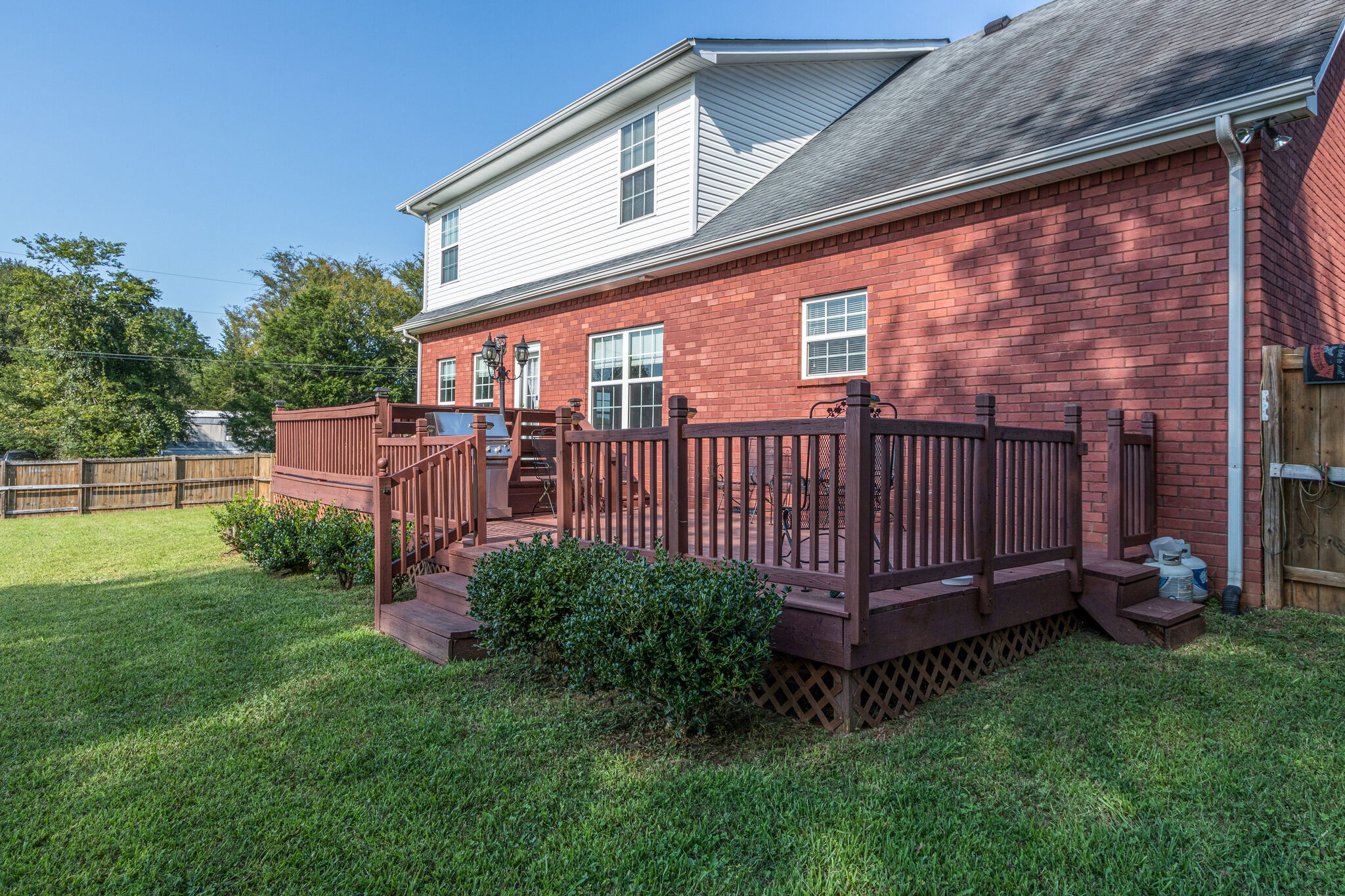 4877 Arnold Drive Murfreesboro, TN 37129 - Photo 29 of 32 a front view of a house with garden and deck