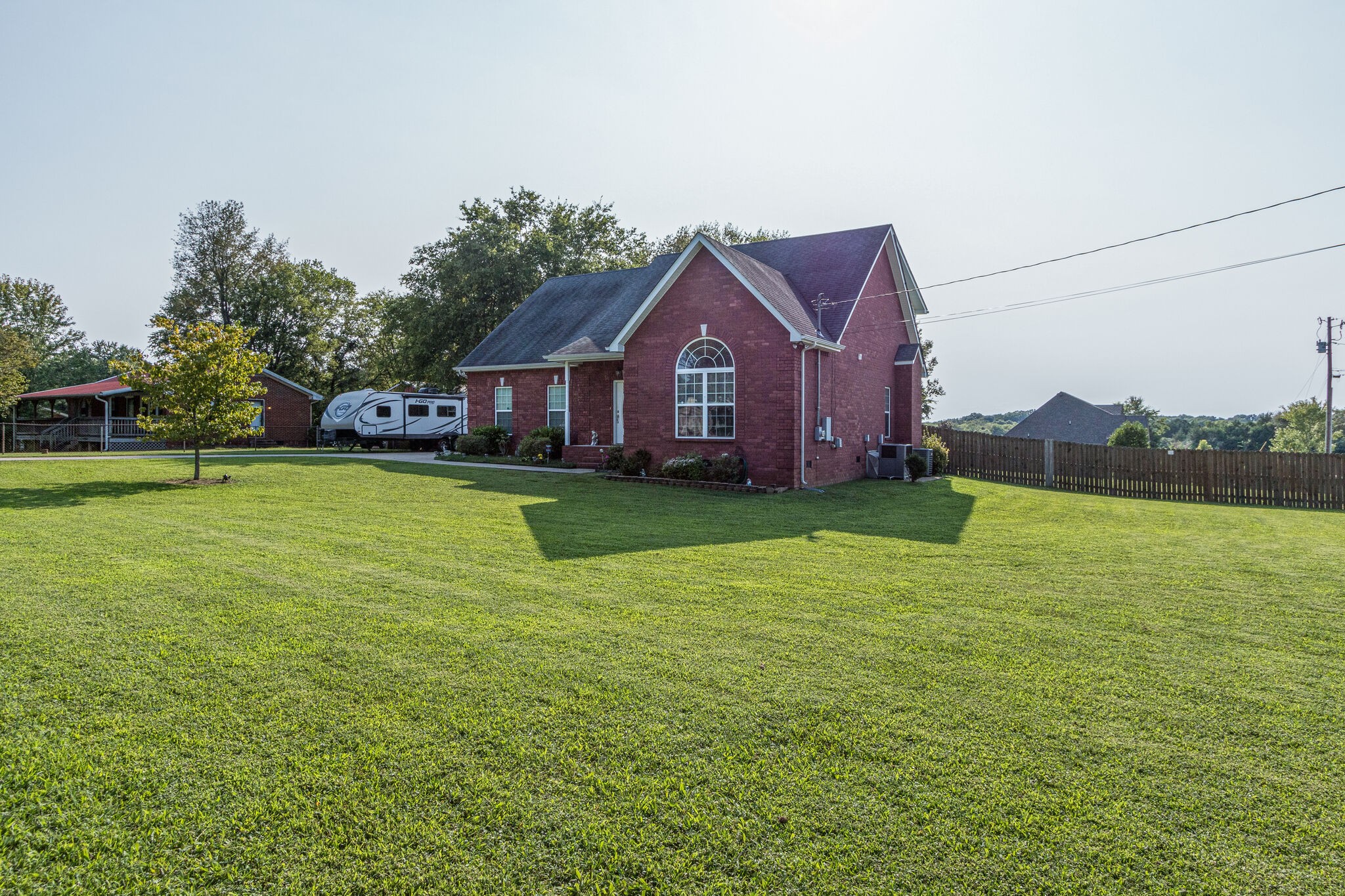 4877 Arnold Drive Murfreesboro, TN 37129 - Photo 3 of 32 a large house with a big yard and large trees