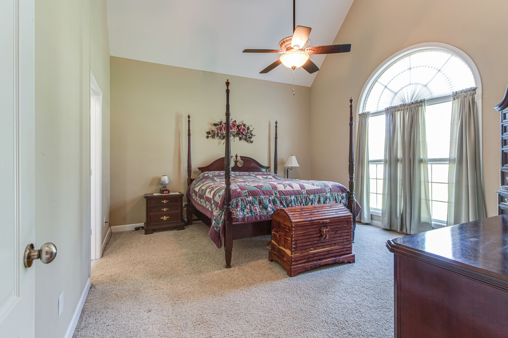 4877 Arnold Drive Murfreesboro, TN 37129 - Photo 6 of 32 a bedroom with a bed and a chandelier