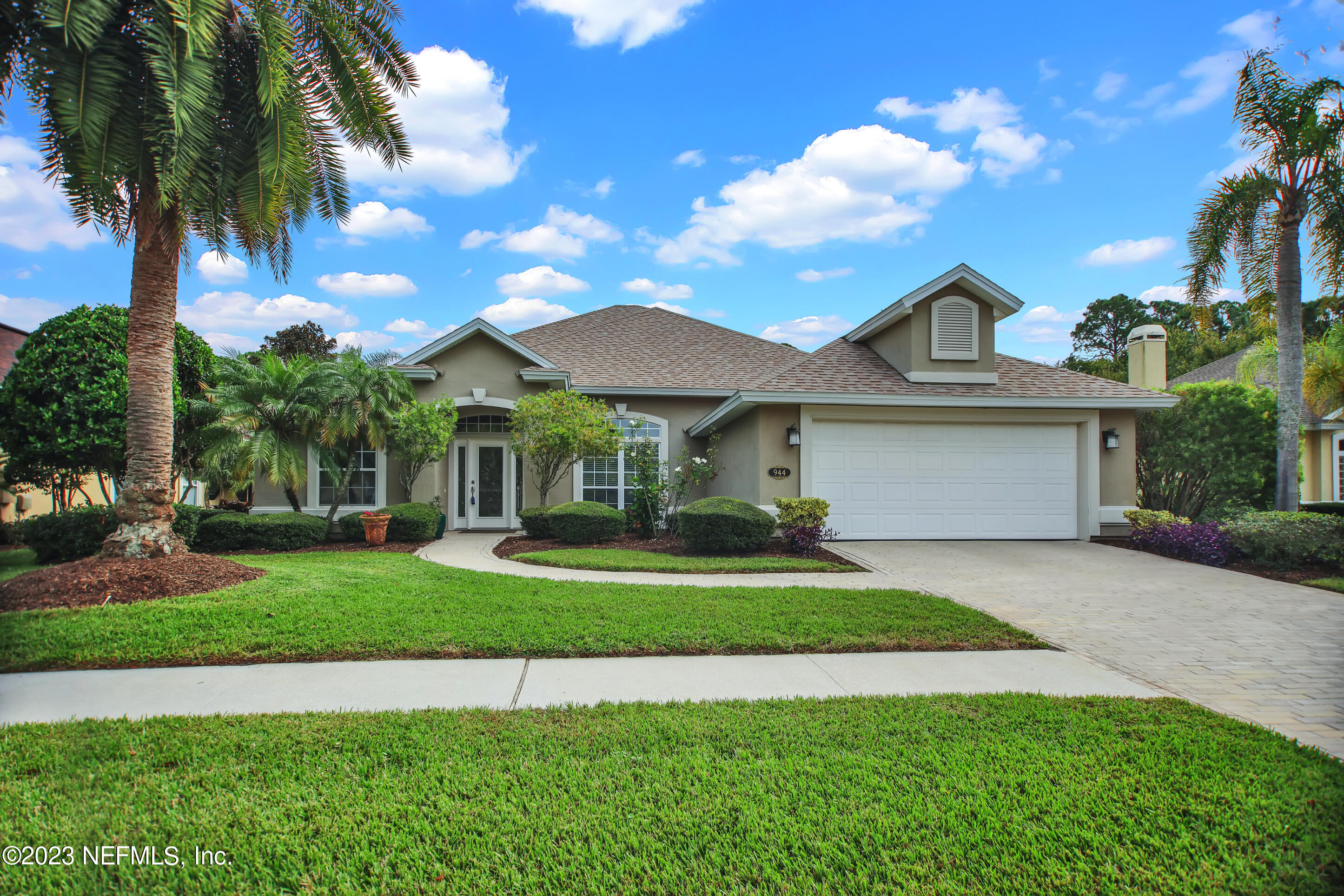 944 Oxford Drive St. Augustine, FL 32084 - Photo 1 of 58 a front view of a house with a yard and garage