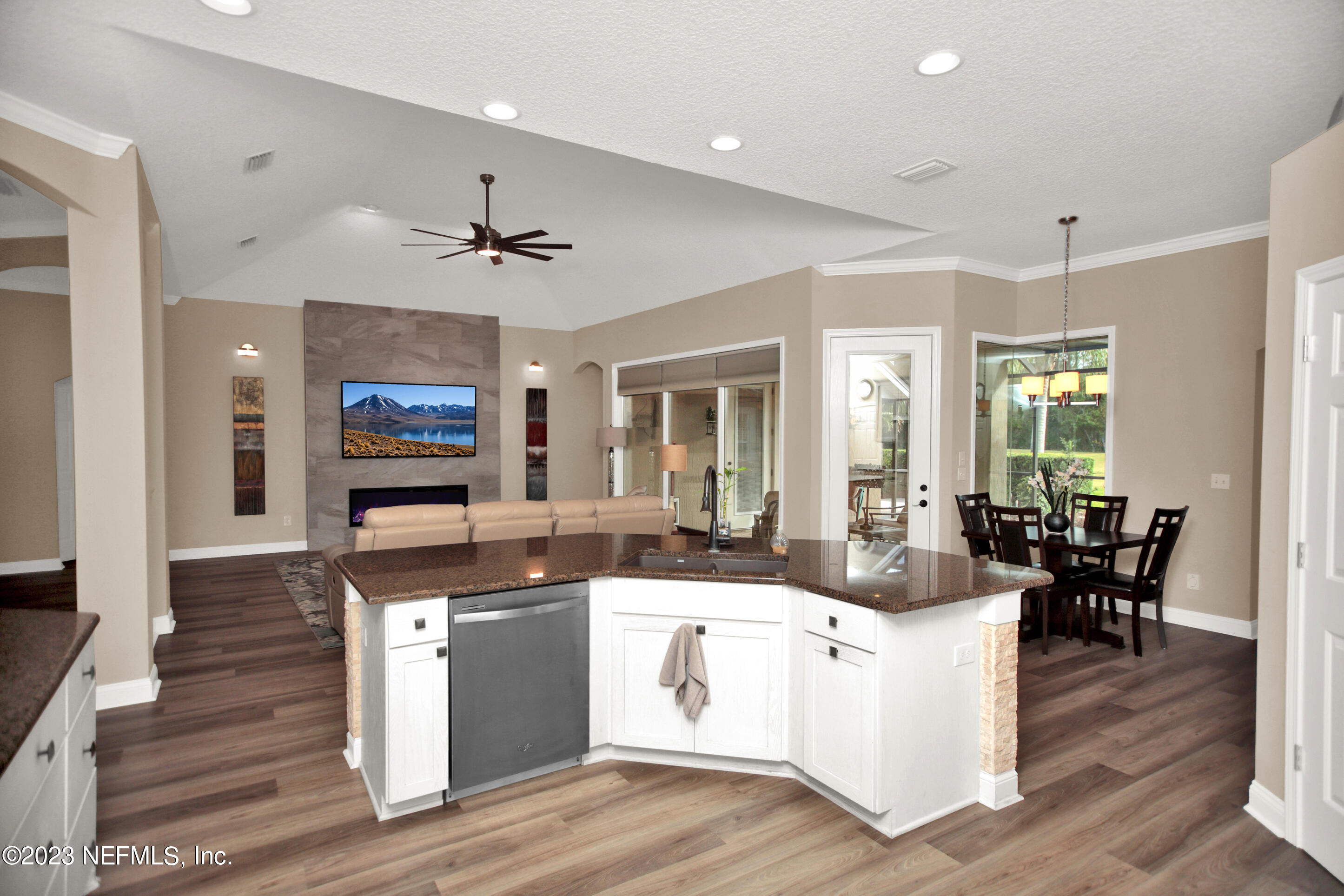 944 Oxford Drive St. Augustine, FL 32084 - Photo 13 of 58 a large kitchen with kitchen island white cabinets and stainless steel appliances