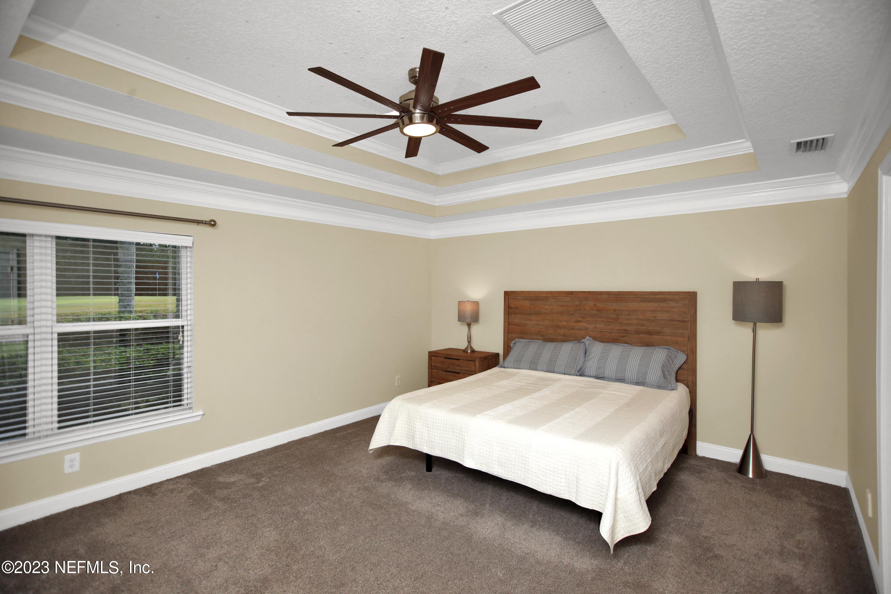 944 Oxford Drive St. Augustine, FL 32084 - Photo 18 of 58 a bedroom with a bed and window