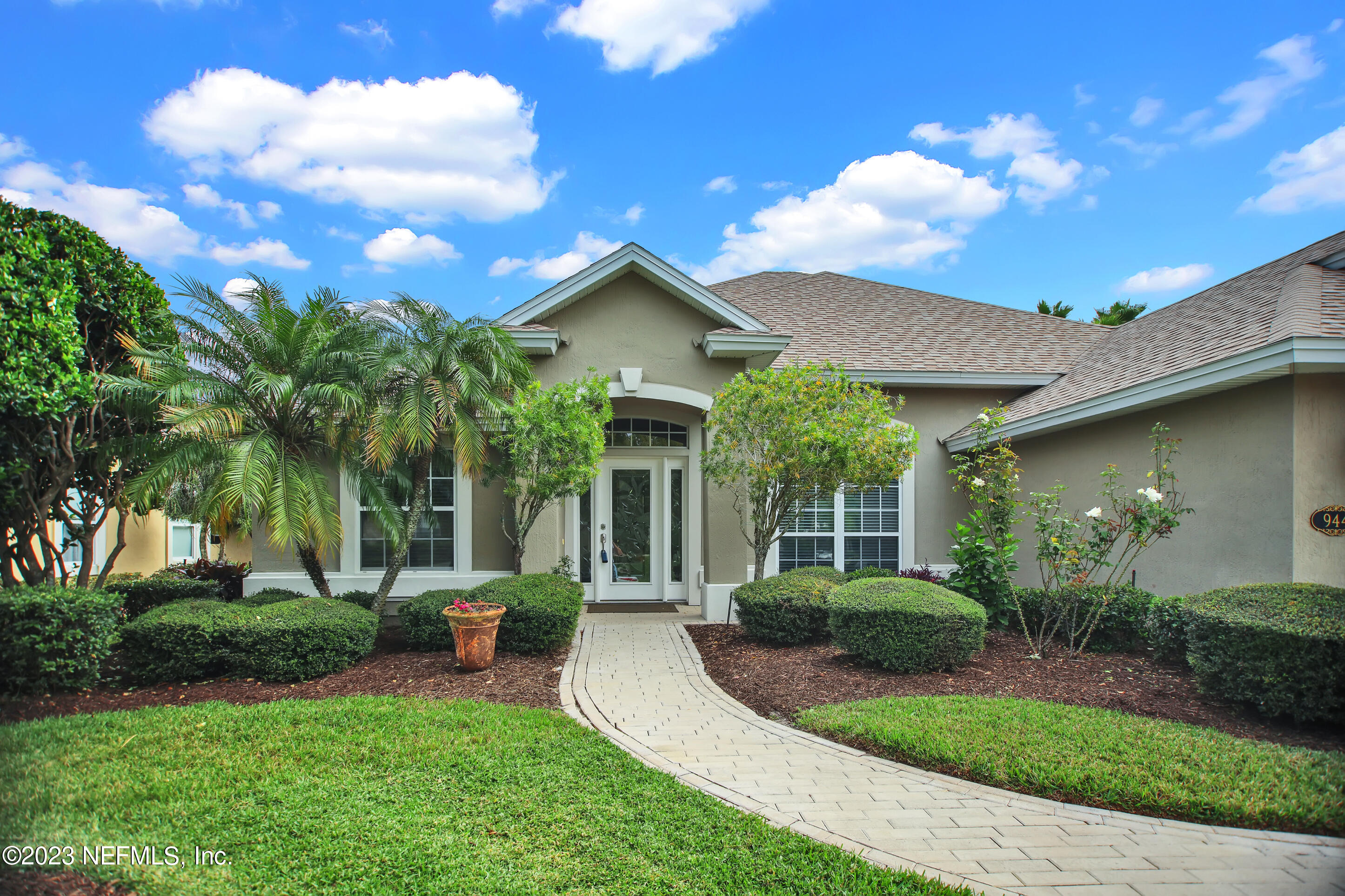 944 Oxford Drive St. Augustine, FL 32084 - Photo 2 of 58 a view of a house with backyard and garden