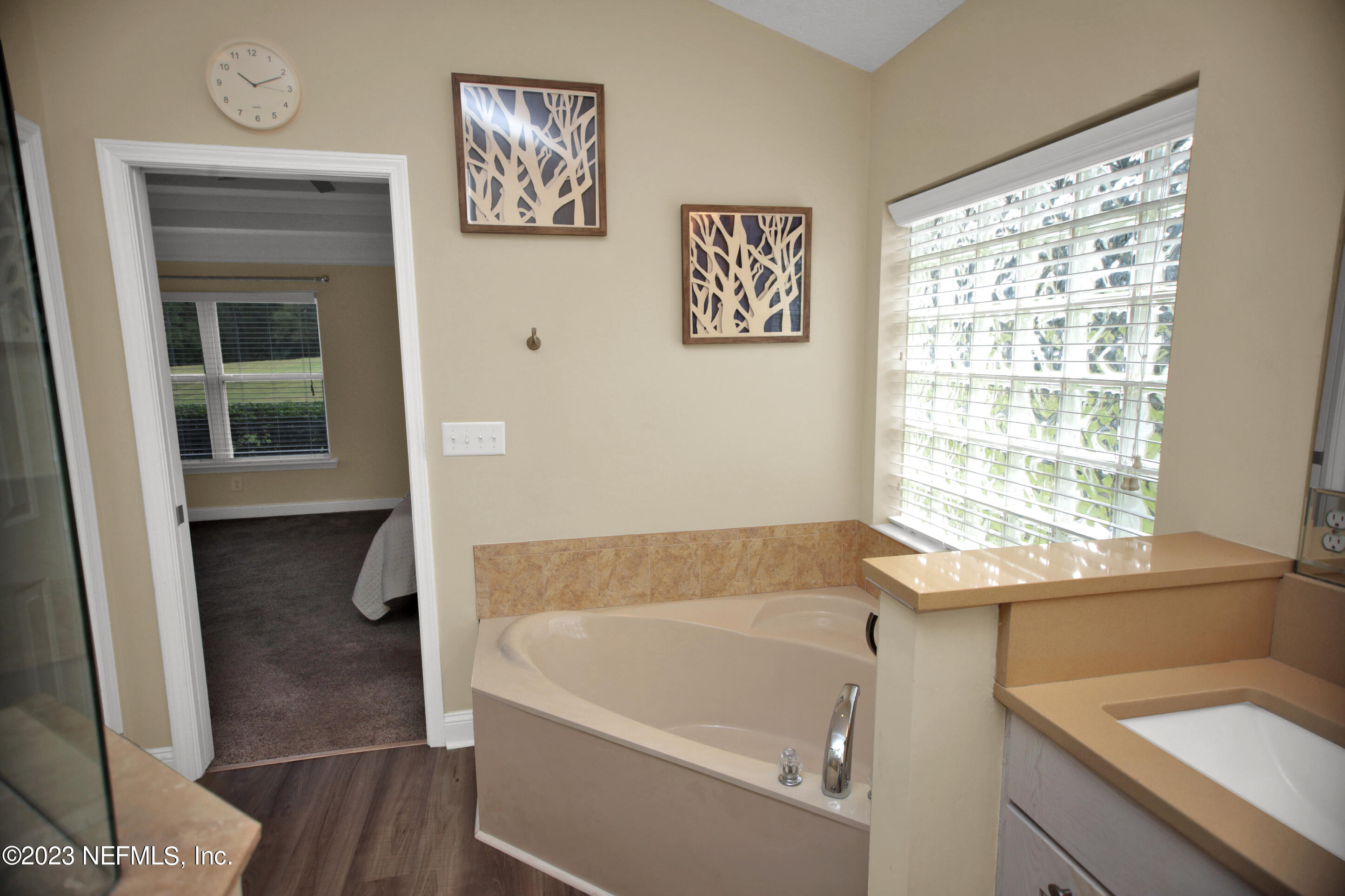 944 Oxford Drive St. Augustine, FL 32084 - Photo 23 of 58 a white bath tub sitting next to a window