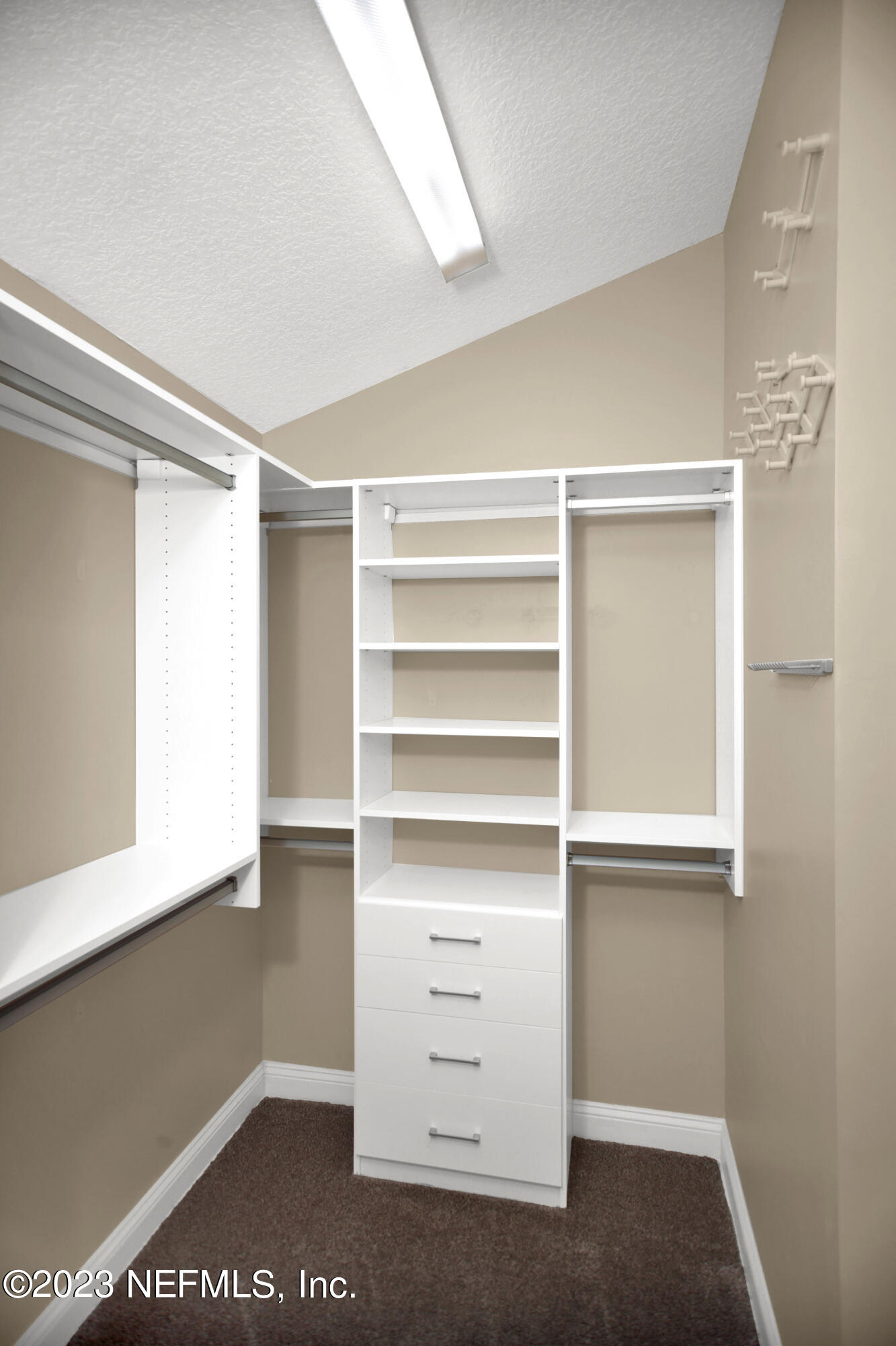 944 Oxford Drive St. Augustine, FL 32084 - Photo 24 of 58 a view of walk in closet with empty racks