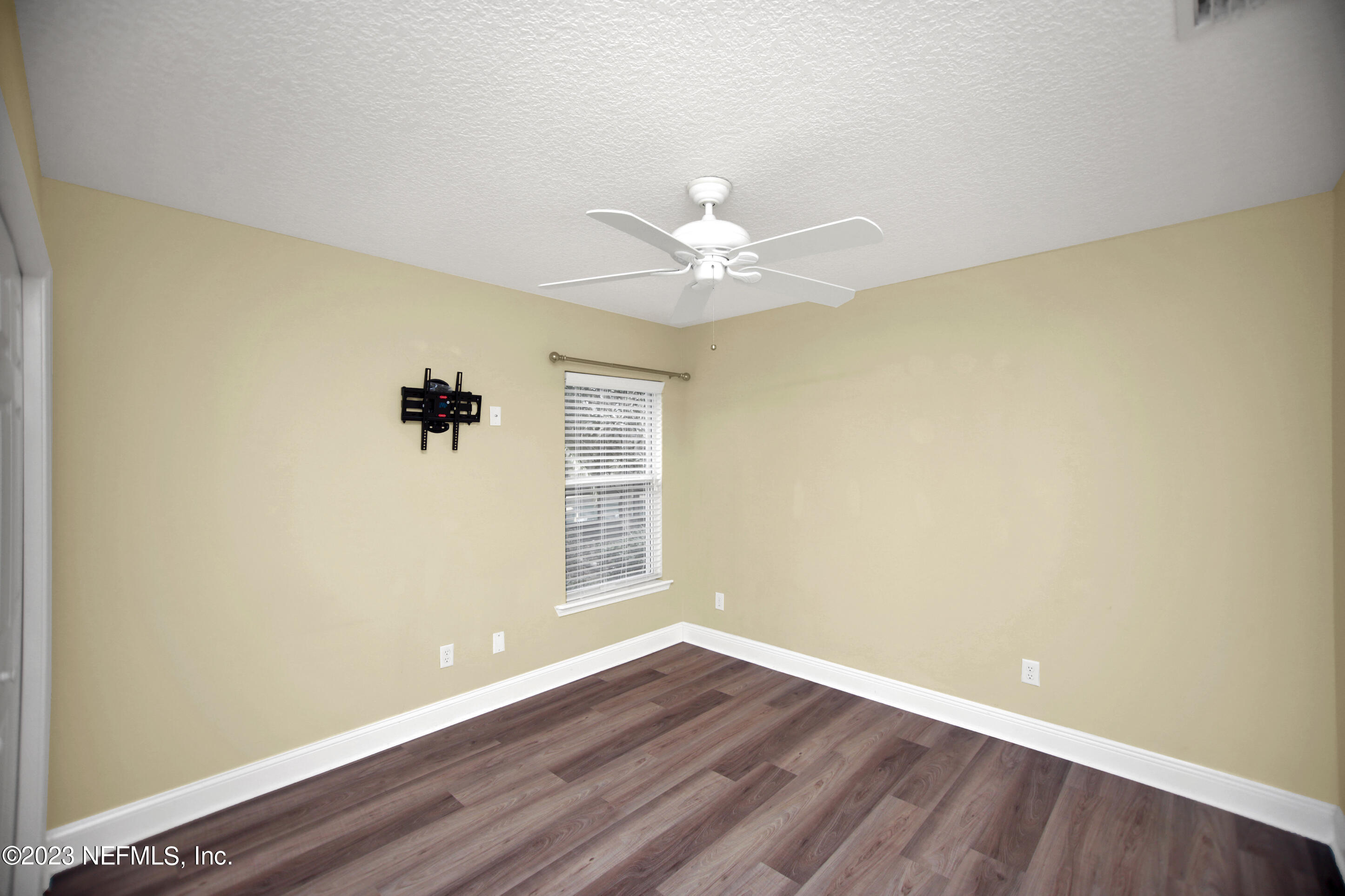 944 Oxford Drive St. Augustine, FL 32084 - Photo 36 of 58 wooden floor in an empty room with a window