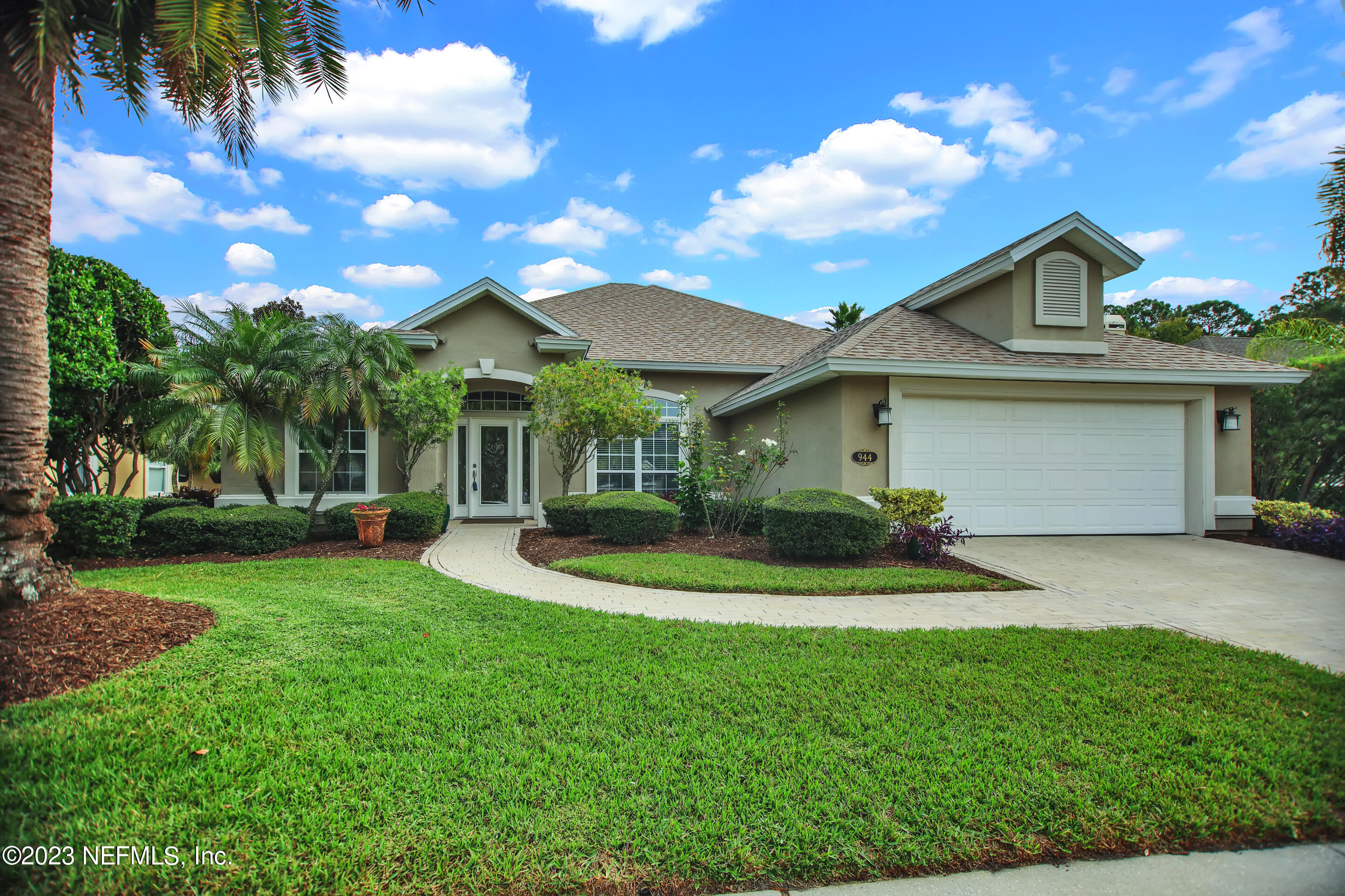 944 Oxford Drive St. Augustine, FL 32084 - Photo 54 of 58 a front view of a house with a yard and porch