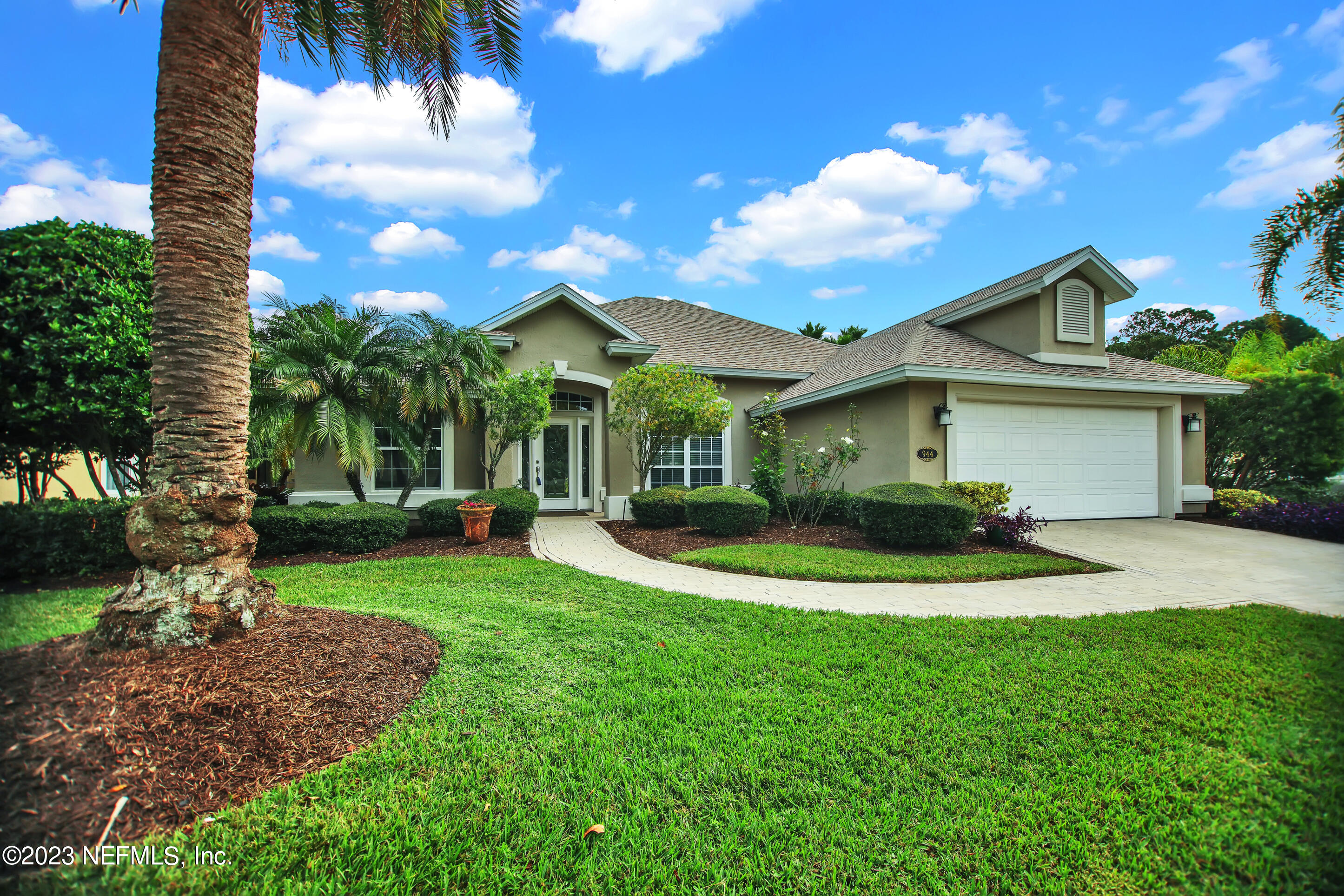 944 Oxford Drive St. Augustine, FL 32084 - Photo 55 of 58 a view of a house with a big yard plants and palm trees