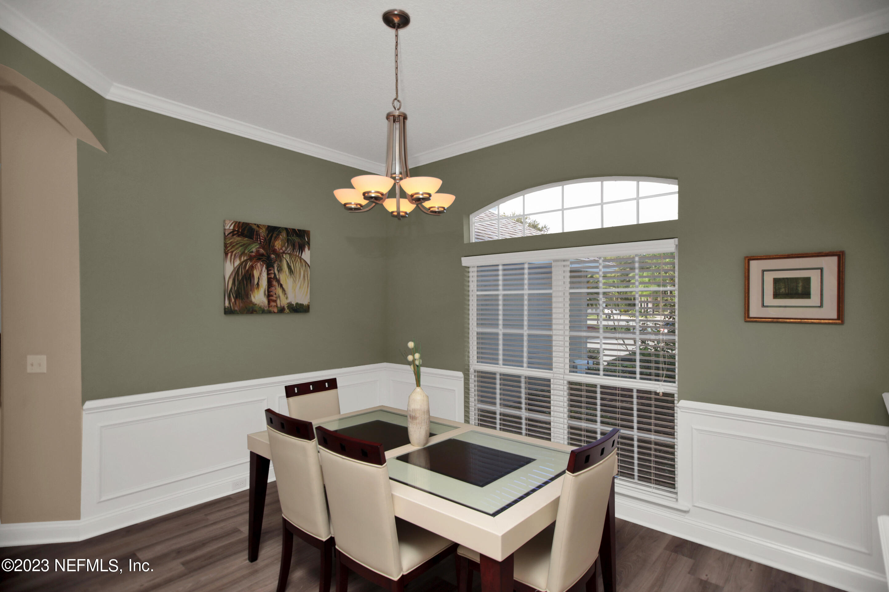 944 Oxford Drive St. Augustine, FL 32084 - Photo 6 of 58 a view of a dining room with furniture window and wooden floor
