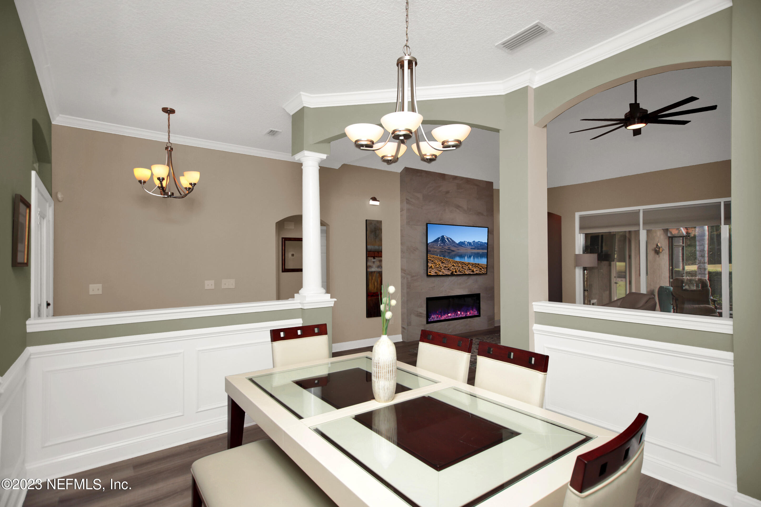 944 Oxford Drive St. Augustine, FL 32084 - Photo 7 of 58 a kitchen with a sink a counter space cabinets and chandelier