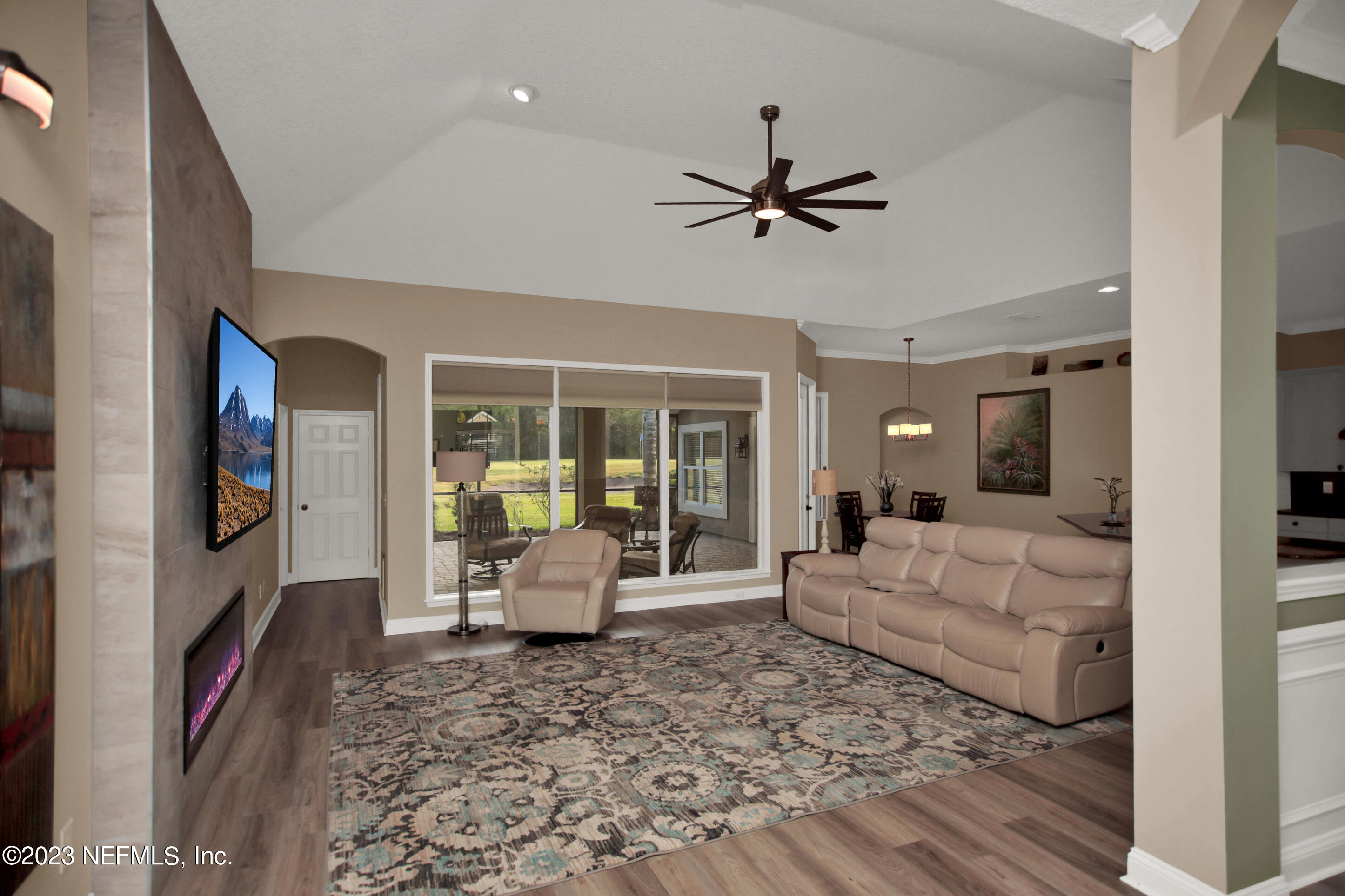 944 Oxford Drive St. Augustine, FL 32084 - Photo 8 of 58 a living room with furniture floor to ceiling window and potted plant
