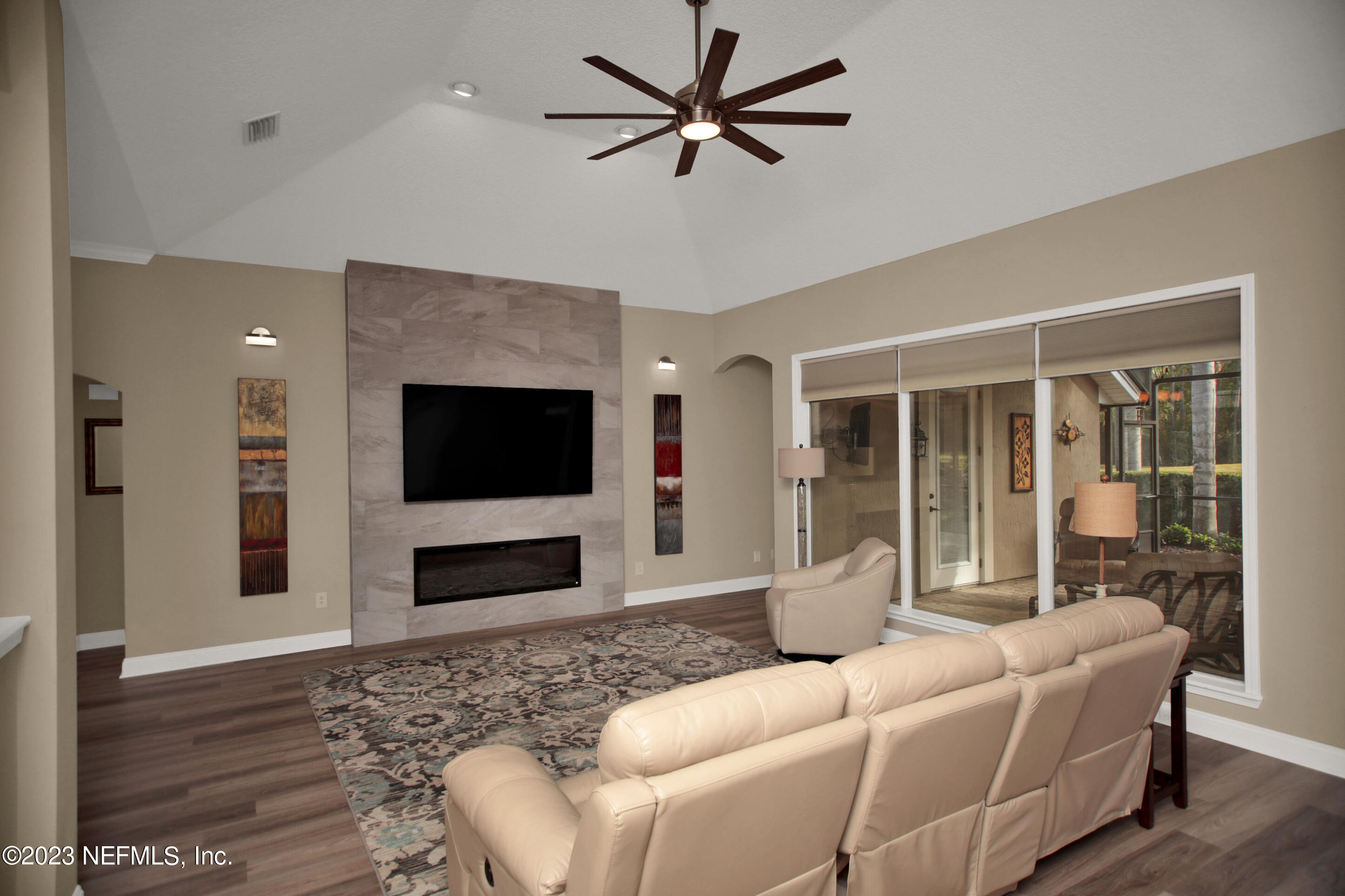 944 Oxford Drive St. Augustine, FL 32084 - Photo 10 of 58 a living room with furniture and a flat screen tv